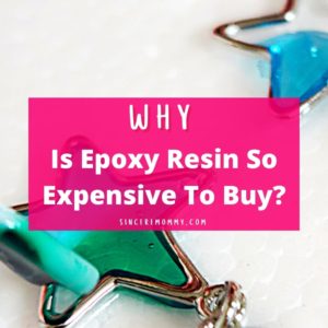 Why is epoxy resin so expensive to buy? Pink banner with blue and green epoxy resin pendants in the background.